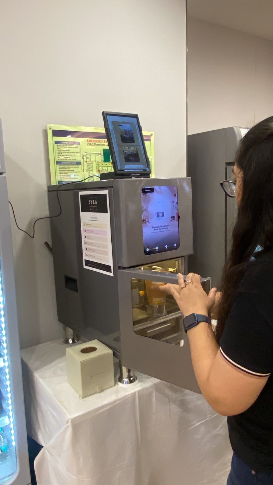 A customer using the SYLA portable how-to screen on site